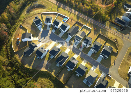 Aerial view of cul de sac at neighbourhood road dead end with densely built homes in South Carolina residential area. Real estate development of family houses and infrastructure in american suburbs Aerial view of cul de sac at neighbourhood road dead end with densely built homes in South Carolina residential area. Real estate development of family houses and infrastructure in american suburbs 97529956