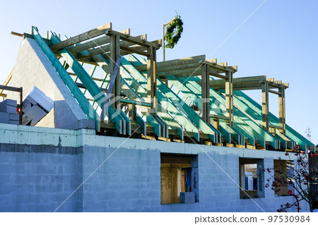 Unfinished wooden structures for the roof of a cement block residential house Unfinished wooden structures for the roof of a cement block residential house 97530984