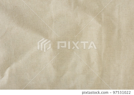 Texture of linen fabric in natural yellow color. The surface of the linen fabric as a background or banner, close-up. Texture of linen fabric in natural yellow color. The surface of the linen fabric as a background or banner, close-up. 97531022