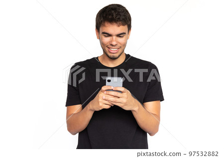 Pleased young man using phone 97532882