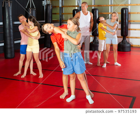 Children self defense training in gym Children self defense training in gym 97535193