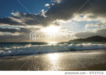 beach and waves at sunset beach and waves at sunset 97537518