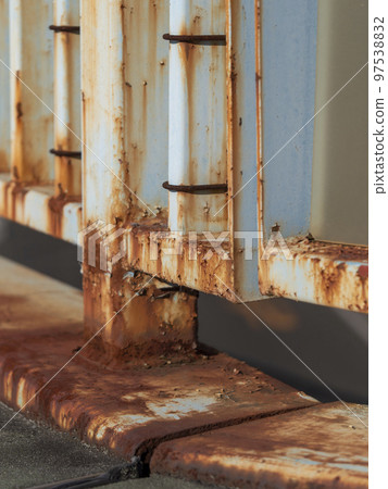 Railing of a rusty pedestrian bridge Railing of a rusty pedestrian bridge 97538832