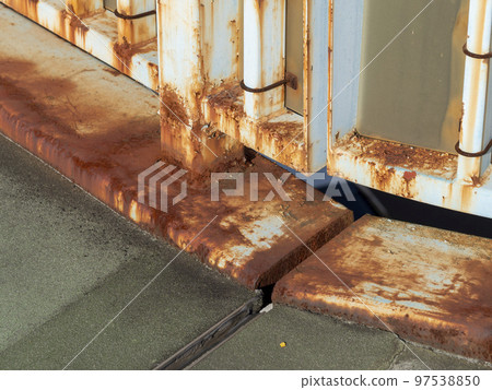 Railing of a rusty pedestrian bridge 97538850