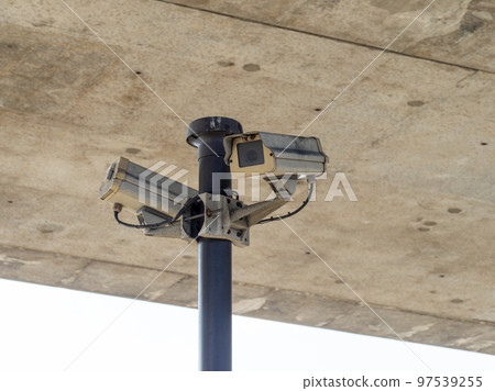 Surveillance camera installed on the pedestrian bridge 97539255