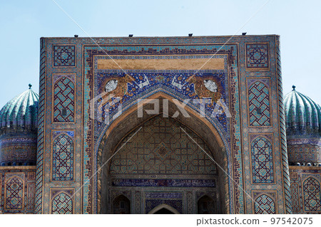 Sherdor Madrasah on Registan Square in Samarkand in Uzbekistan. Fragment of the central part. 29.04.2019 Sherdor Madrasah on Registan Square in Samarkand in Uzbekistan. Fragment of the central part. 29.04.2019 97542075