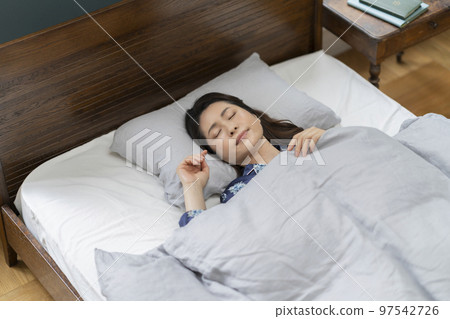 Arafif woman sleeping with a calm expression Sleeping face Arafif woman sleeping with a calm expression Sleeping face 97542726