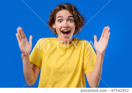 Big large concept. Woman showing invisible abstract subject or object sizes. Size matters. Blue 97542952