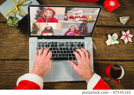 Santa claus with christmas presents having video call with happy caucasian children Santa claus with christmas presents having video call with happy caucasian children 97545185