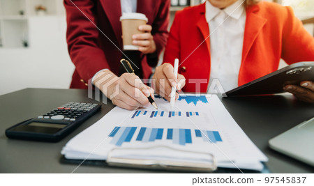Business team meeting present.professional investor working with  Finance managers task. with laptop smart phone and digital tablet 97545837
