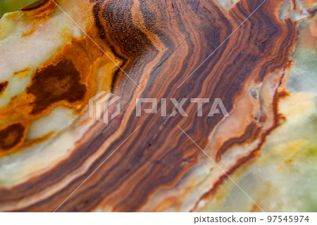 Close up of the pattern and color of the surface of a raw jade stone 97545974