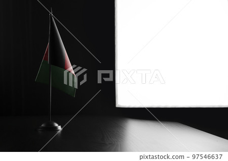 Small national flag of the Afghanistan on a black background Small national flag of the Afghanistan on a black background 97546637