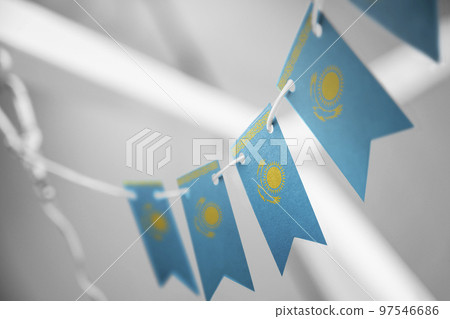 A garland of Kazakhstan national flags on an abstract blurred background 97546686
