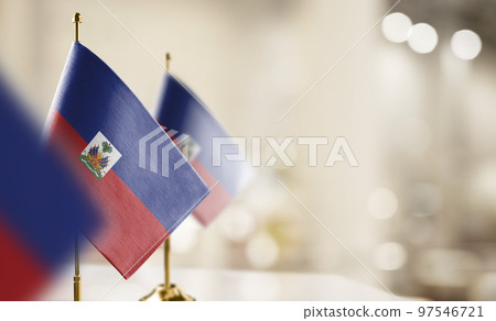 Small flags of the Haiti on an abstract blurry background Small flags of the Haiti on an abstract blurry background 97546721