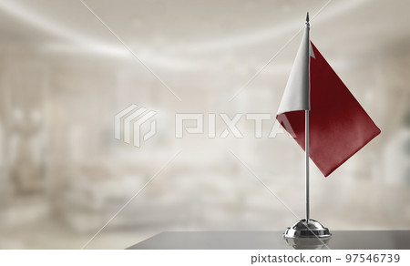 A small Bahrain flag on an abstract blurry background 97546739