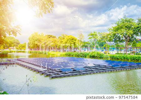 Floating solar panels platform over water lake green park renewable electricity energy technology Floating solar panels platform over water lake green park renewable electricity energy technology 97547584