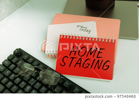 Sign displaying Home Staging. Concept meaning preparation of a private residence for sale in the real estate marketplace 97548468