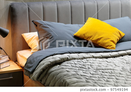 pillows, cushions and blankets on a bed in bedroom pillows, cushions and blankets on a bed in bedroom 97549194