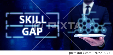 Hand writing sign Skill Gap. Business approach Refering to a person's weakness or limitation of knowlege 97549277