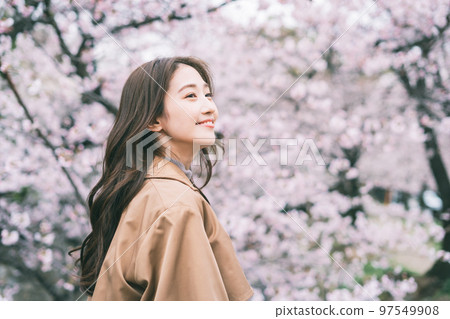 Cherry blossoms and a young woman Cherry blossoms and a young woman 97549908