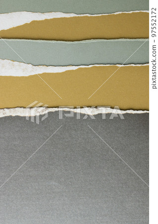 Ripped up pieces of coloured paper with copy space 97552172
