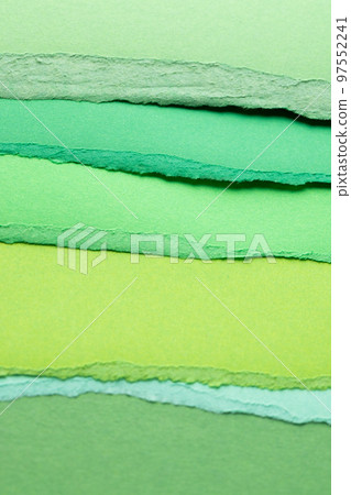 Ripped up pieces of coloured paper with copy space 97552241