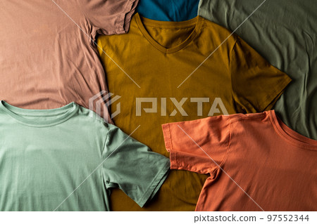 Close up of corrugated multiple coloured tshirts and copy space Close up of corrugated multiple coloured tshirts and copy space 97552344