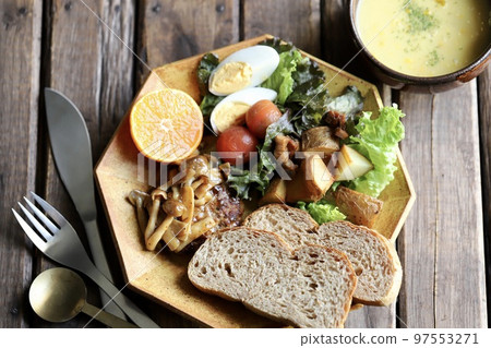 Mushroom hamburger steak, rye bread and plenty of vegetables on a plate lunch 97553271