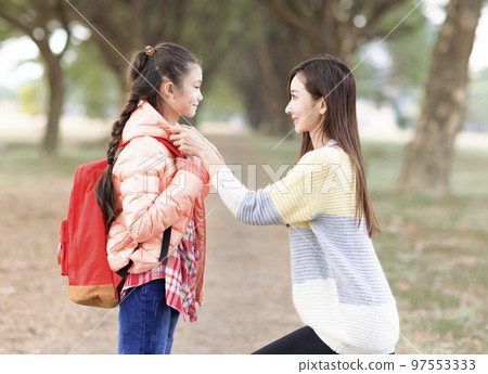 Mother comforting her daughter on the first day Mother comforting her daughter on the first day 97553333
