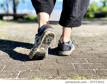 feet of a man walking 97553642