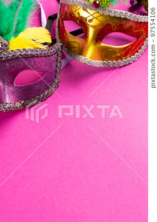 Composition of colourful mardi gras carnival masks on pink background with copy space Composition of colourful mardi gras carnival masks on pink background with copy space 97554106