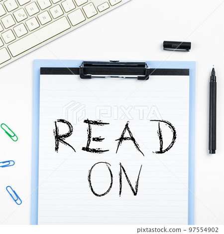 Hand writing sign Read On. Word Written on spend time reading in order to find out information about something Hand writing sign Read On. Word Written on spend time reading in order to find out information about something 97554902