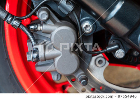 Motorcycle disc brake background Motorcycle disc brake background 97554946
