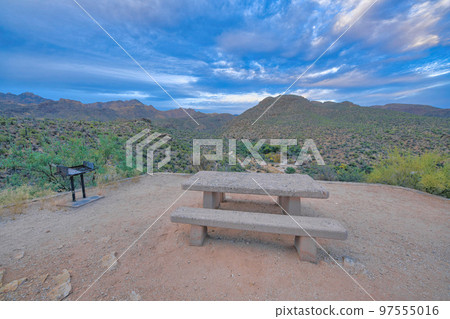 Concrete dining table and in ground grill on a camp site at Sabino Canyon State Park, Tucson, AZ 97555016