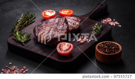 Delicious fresh juicy beef steak with spices and herbs 97555727