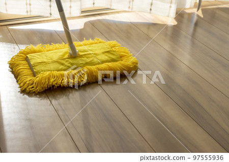 Hardwood floor and yellow mop. image of cleaning 97555936