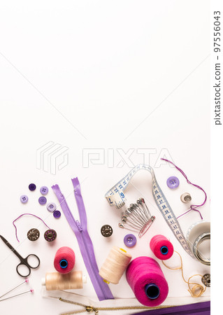 Composition of sewing equipment on white background Composition of sewing equipment on white background 97556043