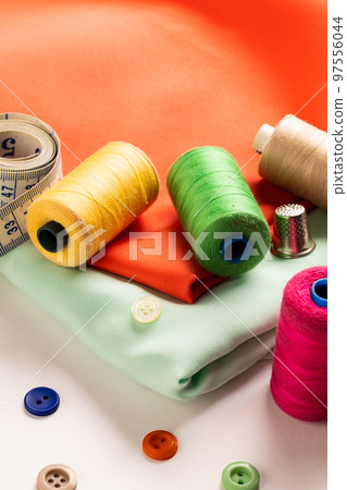 Composition of sewing equipment on white background Composition of sewing equipment on white background 97556044