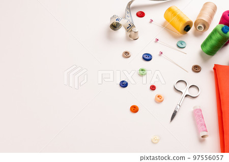 Composition of sewing equipment on white background 97556057