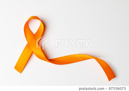 Close up of orange ribbon on white background with copy space Close up of orange ribbon on white background with copy space 97556073