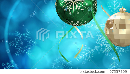 Image of snow falling over christmas bauble decorations on blue background Image of snow falling over christmas bauble decorations on blue background 97557509