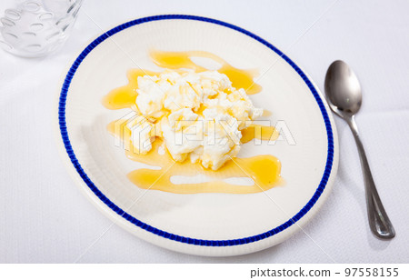 Soft whey cheese mato from goat milk with honey 97558155