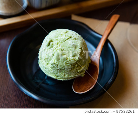 Sweet tasty green tea flovored ice-cream, served with spoon Sweet tasty green tea flovored ice-cream, served with spoon 97558261