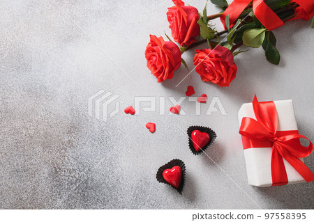 Valentine's day card with romantic gift, red roses. Valentine's day card with romantic gift, red roses. 97558395