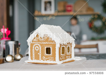 Christmas gingerbread house decorated with glaze Christmas gingerbread house decorated with glaze 97558808