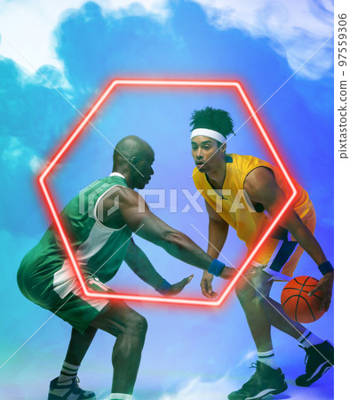 African american basketball male players dribbling ball by illuminated hexagon over smoky background African american basketball male players dribbling ball by illuminated hexagon over smoky background 97559306