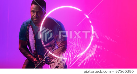 Plants and circle over african american male player holding tennis racket on colored background 97560390