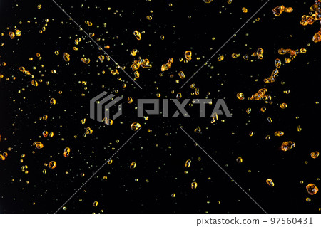 Orange, lemon juice or oil lubricant splash, liquid gold yellow drink drops. Fruit beverage water elements in line form . Fresh splashing and flowing jets, black background isolated freeze motion Orange, lemon juice or oil lubricant splash, liquid gold yellow drink drops. Fruit beverage water elements in line form . Fresh splashing and flowing jets, black background isolated freeze motion 97560431