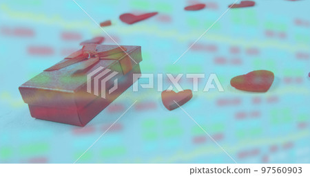 Image of gift box and heart shapes over moving graphs and trading board Image of gift box and heart shapes over moving graphs and trading board 97560903