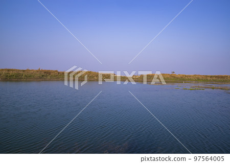 Crystal clear blue water lake landscape view nearby Padma river in Bangladesh Crystal clear blue water lake landscape view nearby Padma river in Bangladesh 97564005